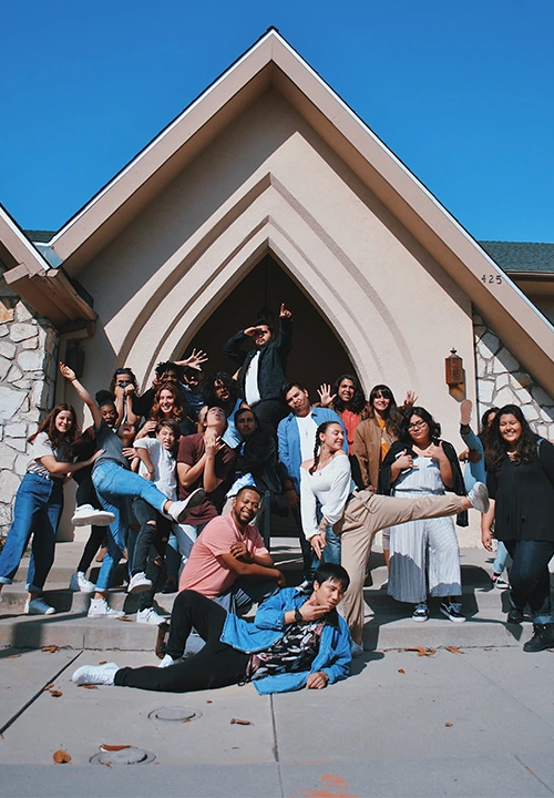 A large group of happy churchgoers and team members